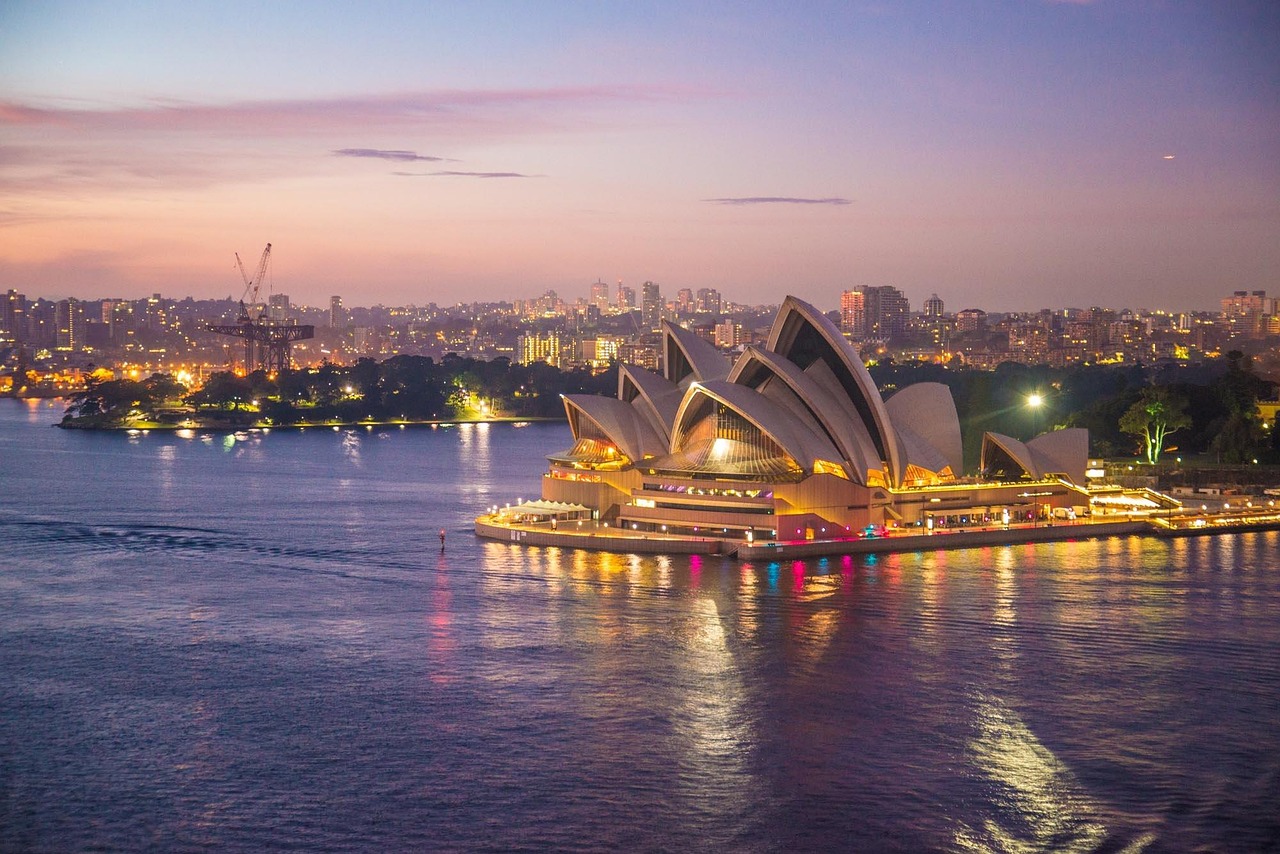 Sydney Opera House and harbor at dusk